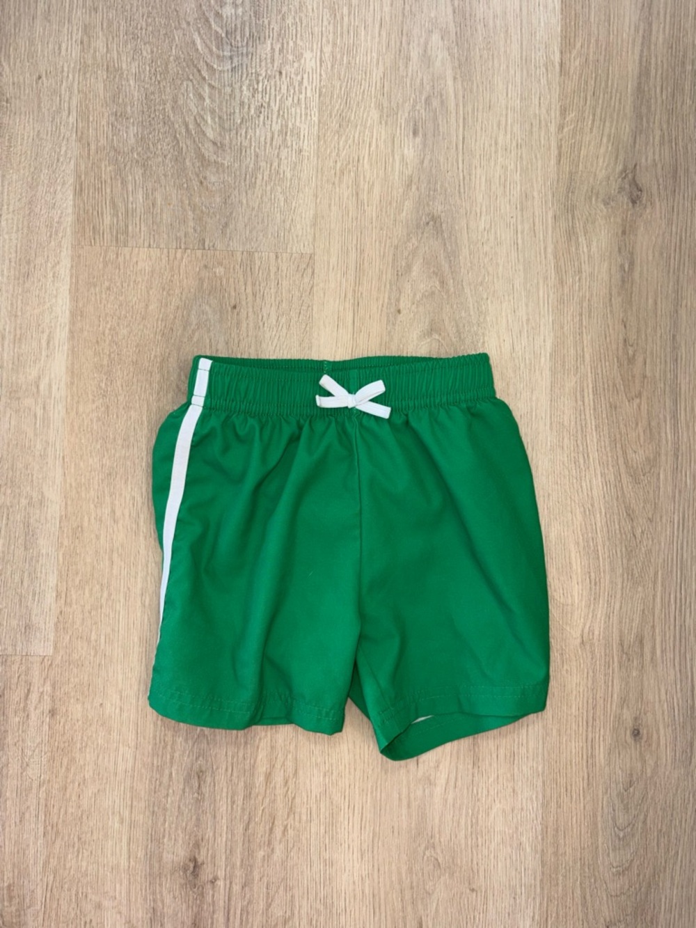 Green Kids' Swim Trunks with White Drawstring and Stripe